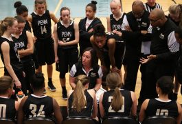 Penn Coach Kristi Ulrich with the Penn Girls Basketball team