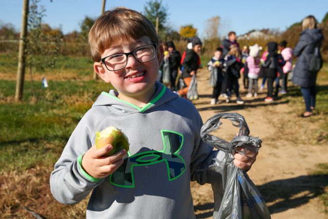 student with apple