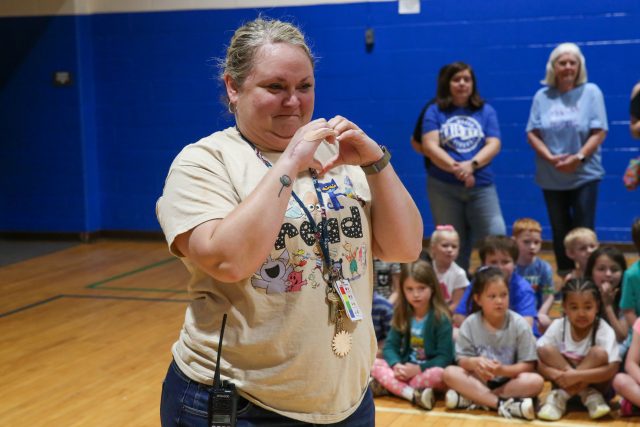 Principal Russell makes heart sign