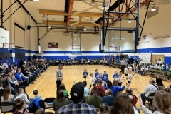 People gathered in a gymnasium for an event.