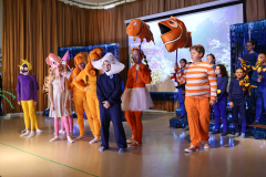 A group of people dressed in colorful costumes, resembling characters from the Disney movie "Finding Nemo,"