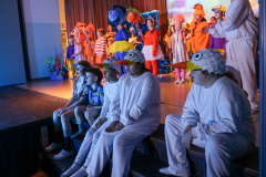 Group of people in costumes on stage for the show Finding Nemo