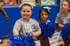 Girl student cheerleaders cheering for the players during the games