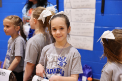 Girl student cheerleaders cheering for the players during the games