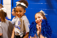 Girl student cheerleaders cheering for the players during the games