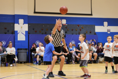 First graders playing in their March Madness basketball game