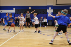 First graders playing in their March Madness basketball game