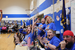 Moran staff cheer as students play basketball