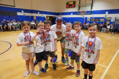 First grade "White Team" student players with their coach
