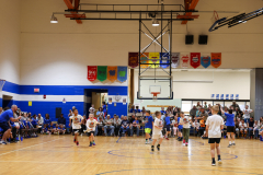 Second graders playing in their March Madness basketball game