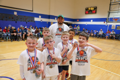 Second grade "White Team" student players with their coach