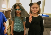 Two children in costumes posing for a picture.